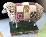 Sheep dressed up in a quilt