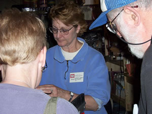 Joanne demonstrates the Strauch Carder at Maryland Sheep and Wool Festival